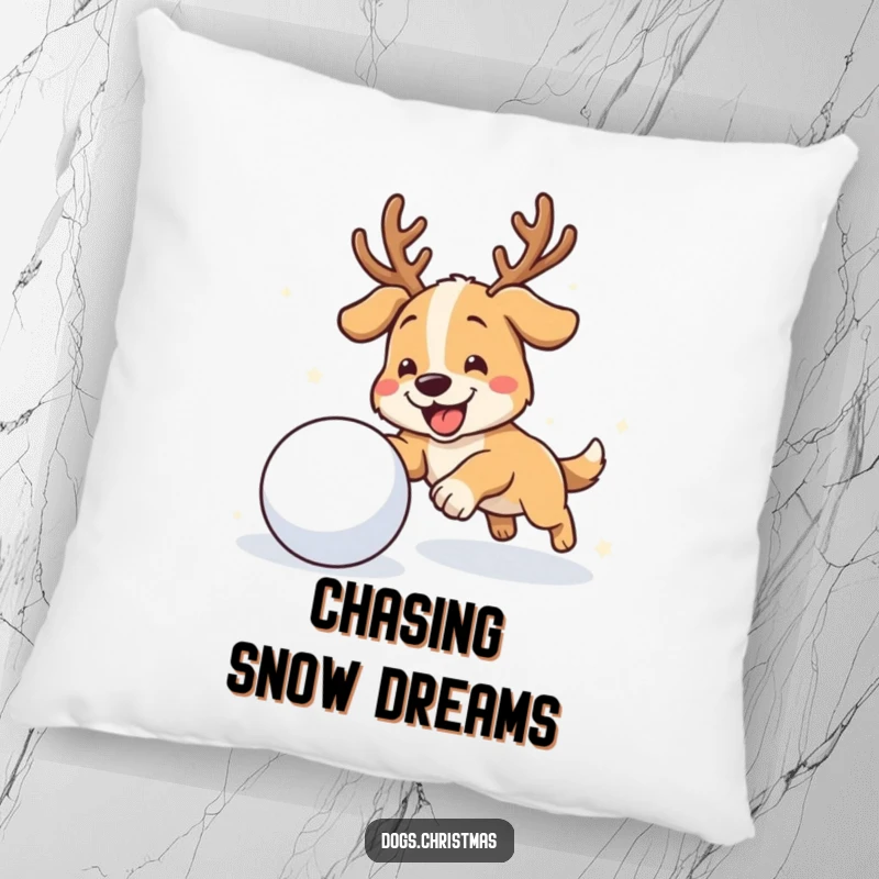 Funny antler dog pillow featuring a dog with antlers gleefully chasing a snowball, perfect for cozy winter decor.