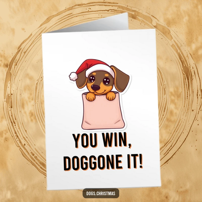 Humorous free printable congratulations card of a dachshund wearing a Santa hat, peeking from a gift bag.