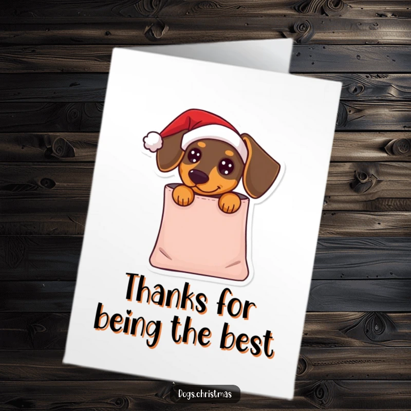 Funny free printable thank you card showing a dachshund with a Santa hat peeking out of a gift bag.
