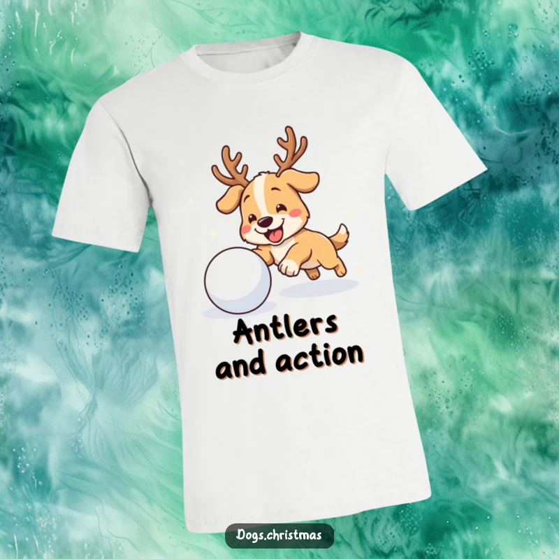 Funny antler dog t-shirt featuring a dog with antlers, gleefully pursuing a rolling snowball in a snowy landscape.